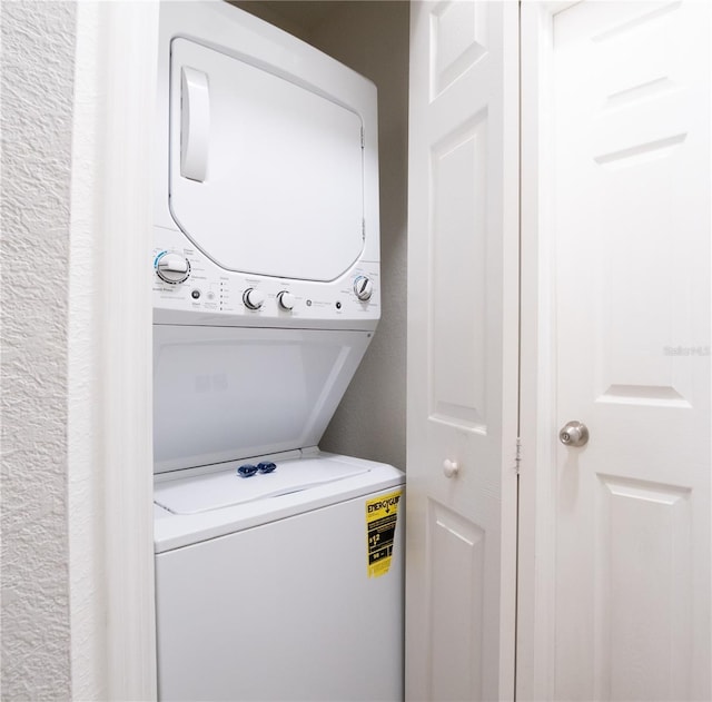 laundry area featuring stacked washer and dryer