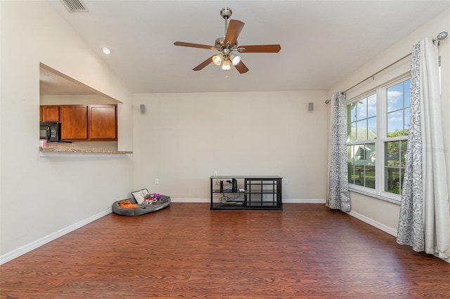 empty room featuring dark wood-type flooring and ceiling fan