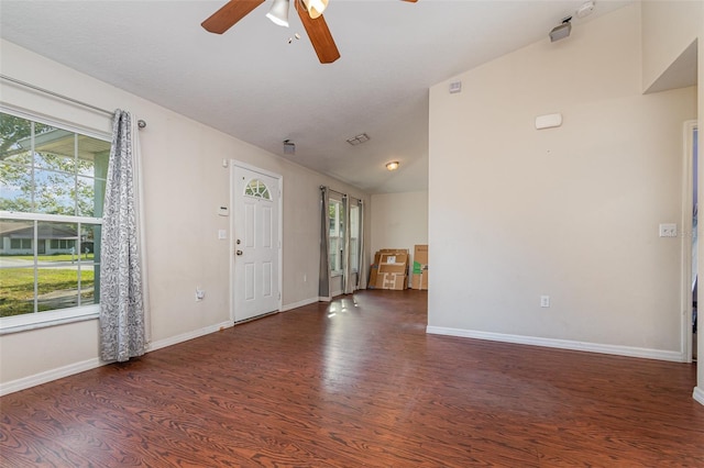 entrance foyer featuring lofted ceiling, dark wood-type flooring, and ceiling fan