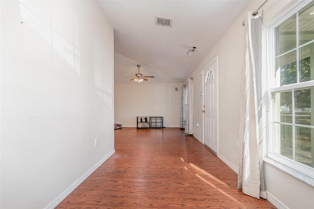 corridor with dark hardwood / wood-style floors