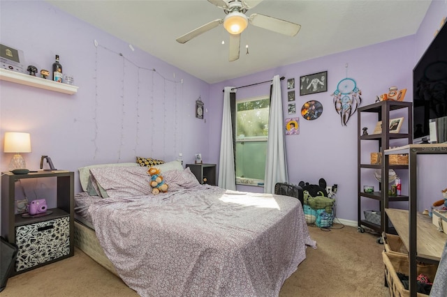 bedroom with light carpet and ceiling fan