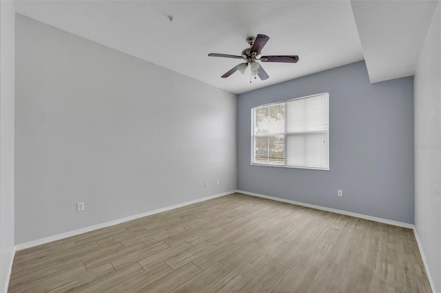 unfurnished room featuring ceiling fan and light wood-type flooring