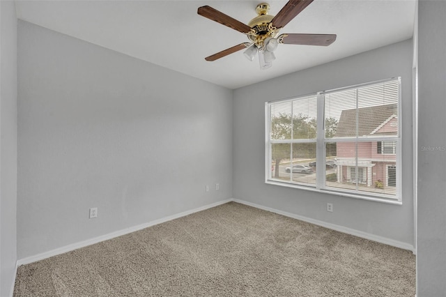 empty room featuring light carpet and ceiling fan