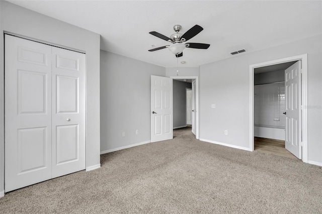 unfurnished bedroom featuring carpet flooring, ceiling fan, and a closet