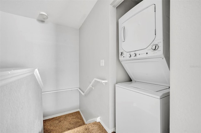 laundry room with stacked washer / dryer and carpet