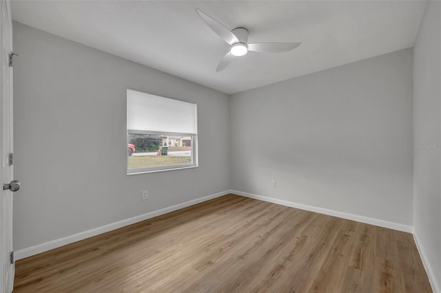 empty room featuring ceiling fan and light hardwood / wood-style floors