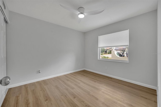 empty room featuring ceiling fan and light hardwood / wood-style floors