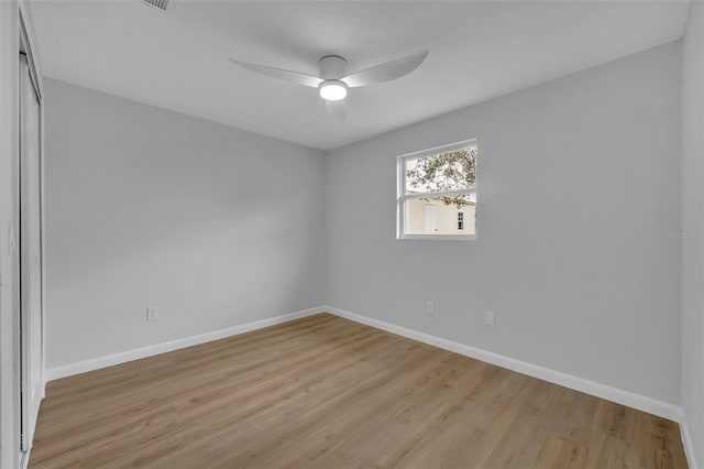 empty room featuring light hardwood / wood-style flooring and ceiling fan