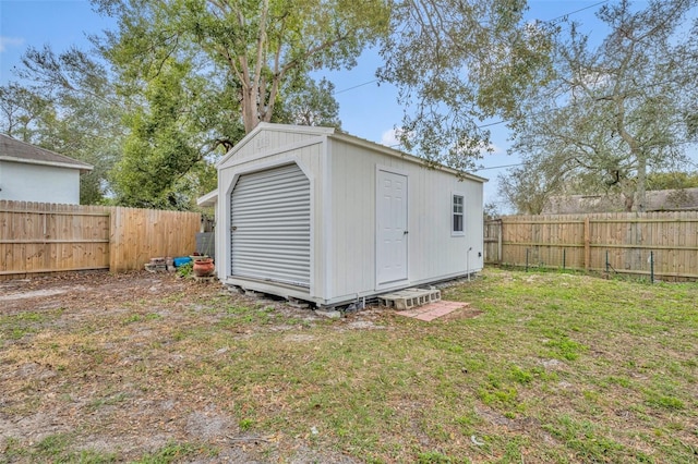 view of outdoor structure featuring a lawn