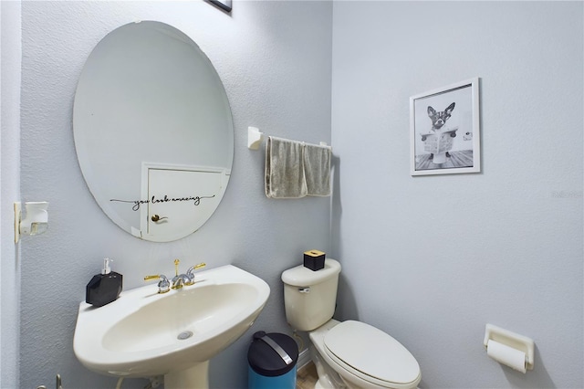 bathroom with sink and toilet