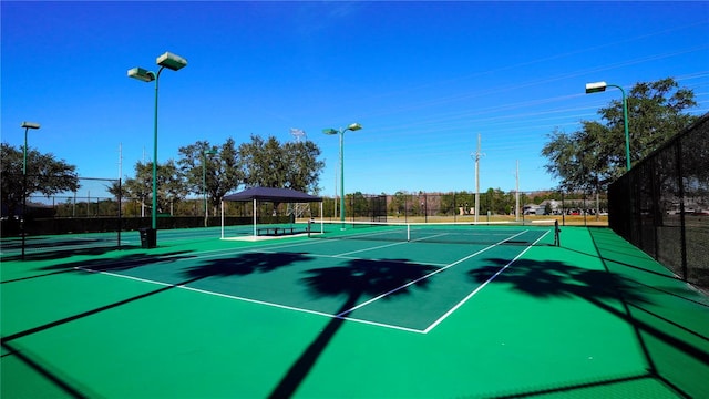 view of sport court featuring basketball hoop