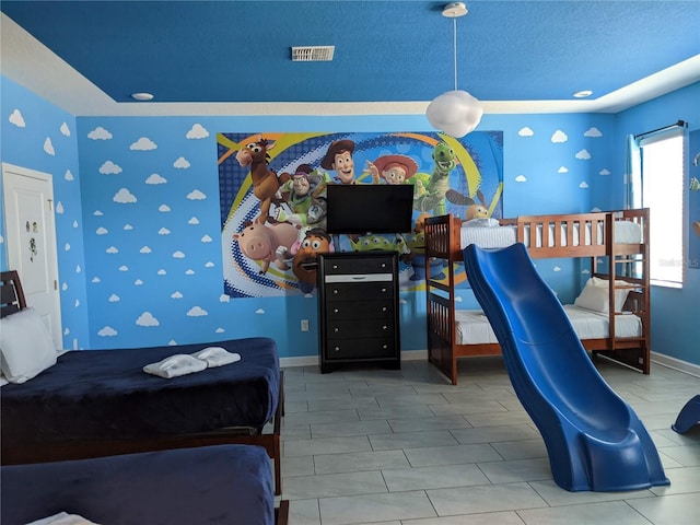 bedroom featuring a textured ceiling