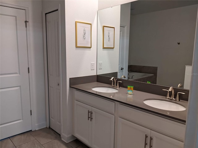 bathroom featuring vanity and tile patterned flooring