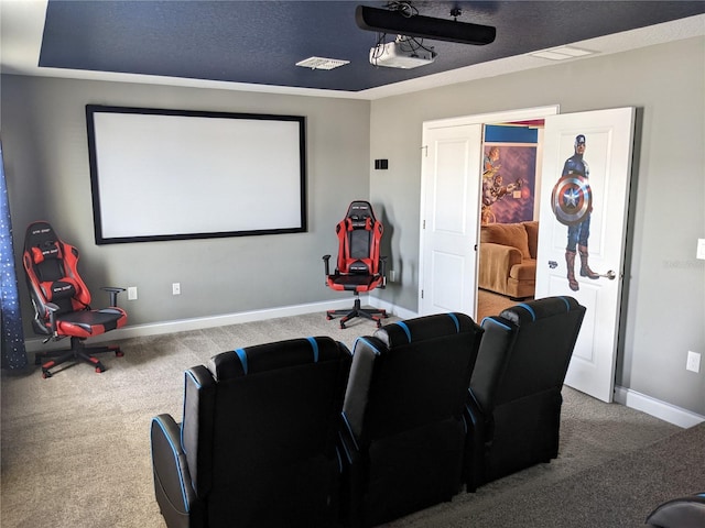 home theater room with carpet floors and a textured ceiling