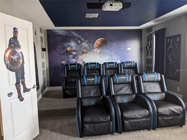 home theater with a textured ceiling and carpet flooring