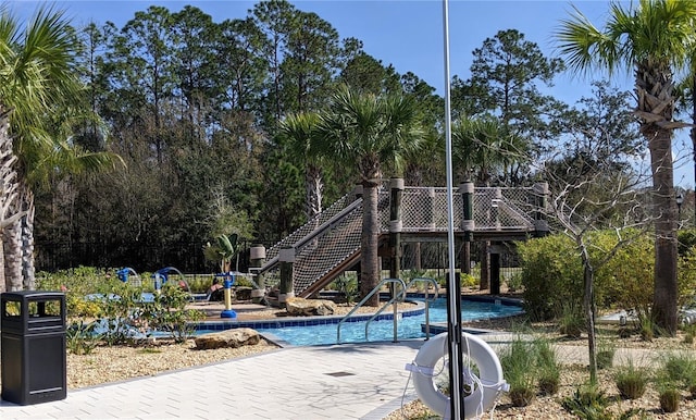 view of pool featuring a patio