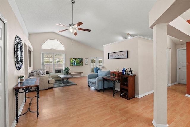 living room featuring ceiling fan, high vaulted ceiling, and light wood-type flooring