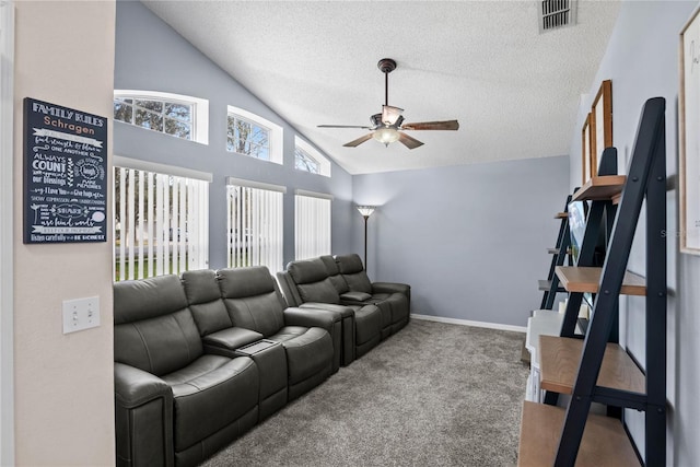 living room with ceiling fan, lofted ceiling, carpet floors, and a textured ceiling