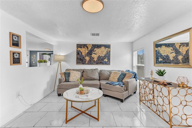 living room featuring a textured ceiling