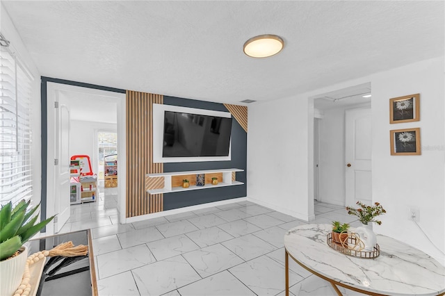 living room with a textured ceiling