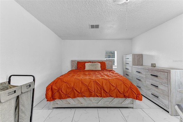 bedroom with a textured ceiling