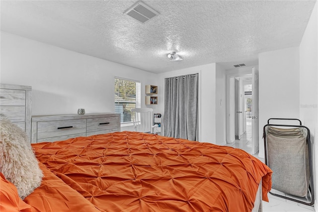 bedroom featuring a textured ceiling