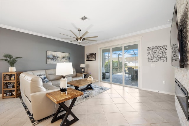 tiled living room with crown molding and ceiling fan