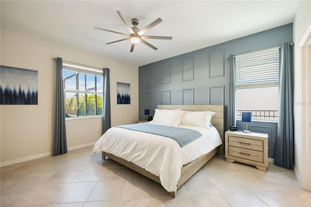 tiled bedroom with ceiling fan