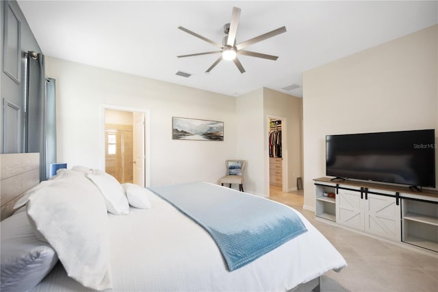 bedroom with ceiling fan, a spacious closet, and a closet