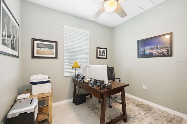 tiled office space with ceiling fan