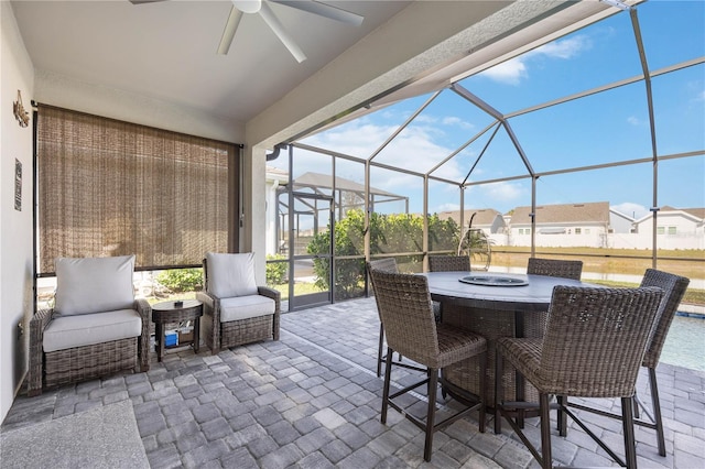 view of patio / terrace with a lanai and ceiling fan