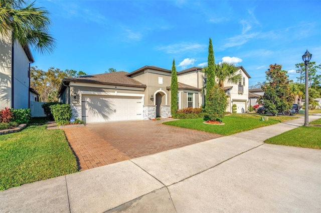 view of front of home featuring a garage and a front lawn