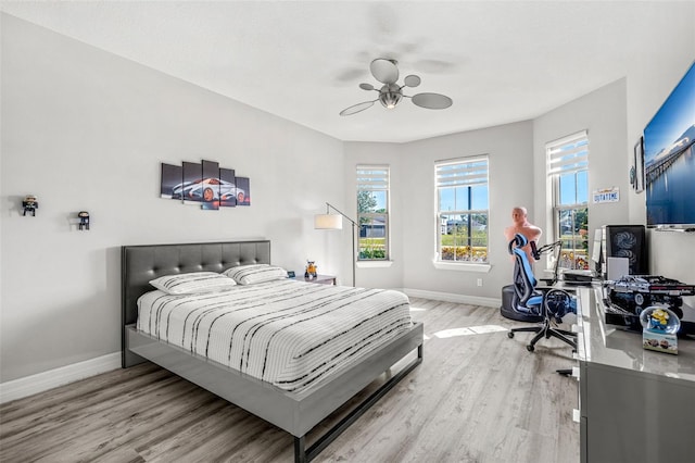 bedroom featuring ceiling fan and light wood-type flooring