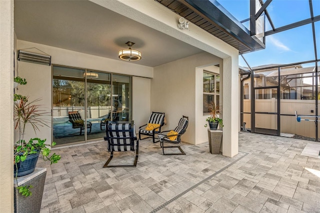 view of patio / terrace featuring glass enclosure