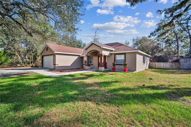 view of front of property with a garage and a front lawn