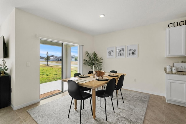 dining room featuring light tile patterned floors