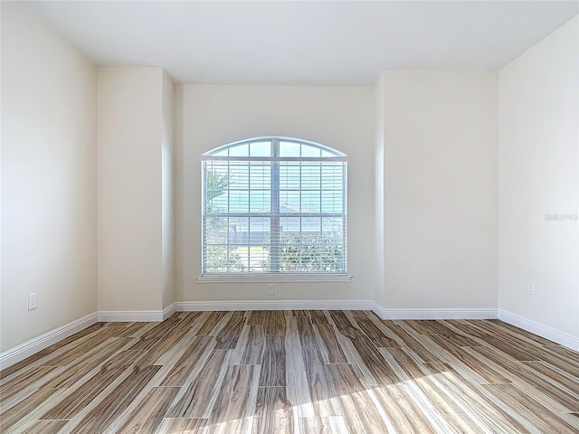 empty room with light hardwood / wood-style floors