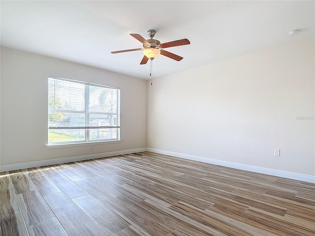 spare room with ceiling fan