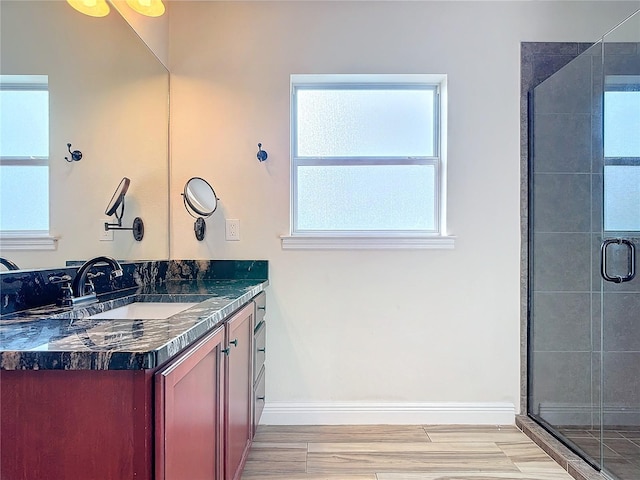 bathroom with vanity, hardwood / wood-style floors, and walk in shower