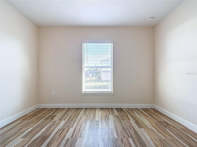 spare room featuring light wood-type flooring