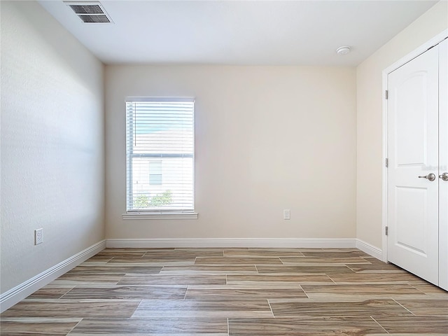 empty room featuring light hardwood / wood-style floors