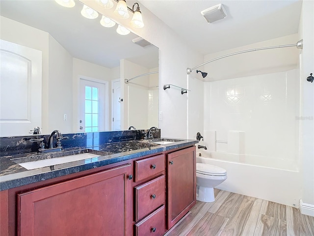 full bathroom with vanity, shower / washtub combination, and toilet