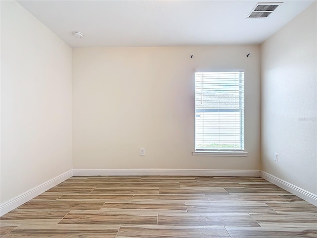 empty room featuring light hardwood / wood-style floors