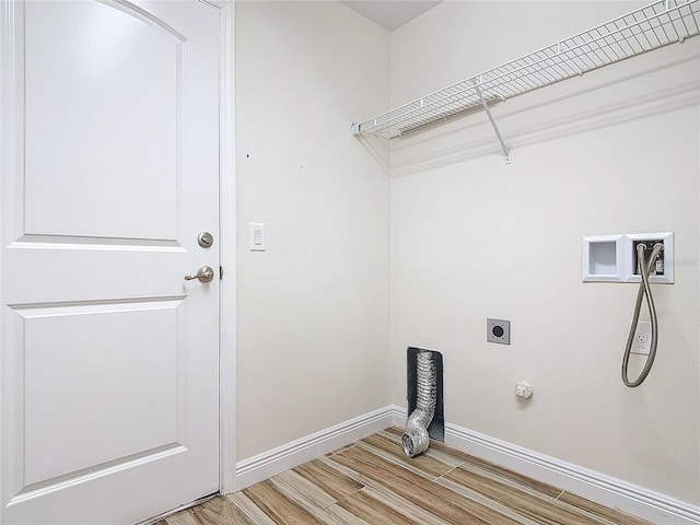 laundry area featuring electric dryer hookup, washer hookup, hardwood / wood-style flooring, and hookup for a gas dryer