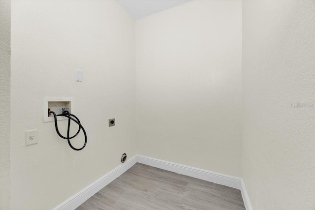 laundry area featuring hookup for a washing machine and hookup for an electric dryer