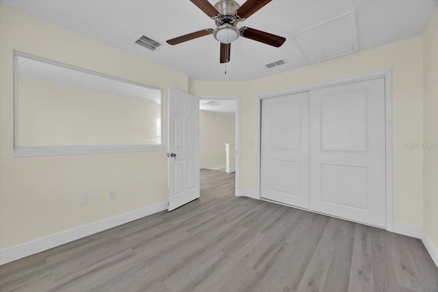 unfurnished bedroom featuring light hardwood / wood-style flooring, a closet, and ceiling fan