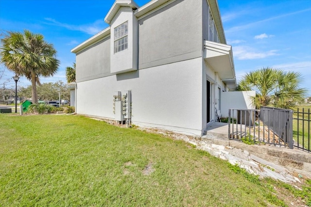 view of home's exterior featuring a lawn