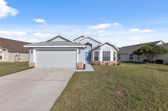 ranch-style home featuring a garage and a front lawn