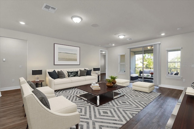 living room with dark hardwood / wood-style flooring