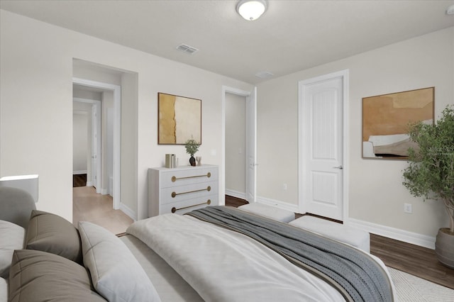 bedroom with wood-type flooring